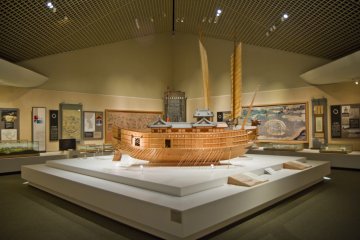 <p>The two 16th century ships, with the Japanese one in the foreground; the Korean Turtle Ship's sails are seen behind it</p>