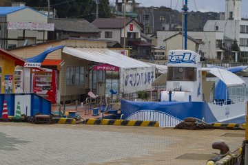 <p>At the main pier: the Zeela offers see-through hull tours out to Taka Island</p>