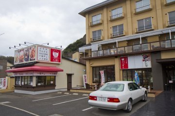 <p>A restaurant on the harbor; the windows in front on the left are for takeout orders</p>