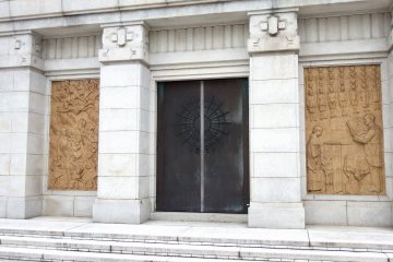 <p>Western-looking entrance to the tower. I wonder if the mark on the door is an anchor?</p>