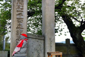 Gate posts and Buddha statue