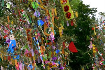 <p>The bamboo branches are loaded with hand-made decorations</p>
