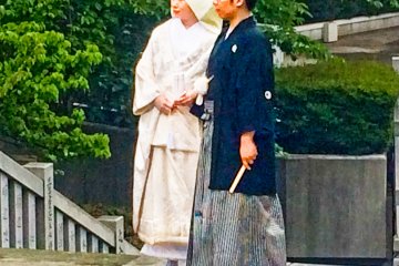 <p>A bride and groom. Notice how the bride is wearing a 'Shiro-Kakeshita' (a white kimono)</p>