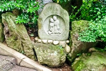 <p>A stone carving depicting a newly married couple. Iseyama&nbsp;Kotai is a popular place for newlyweds to receive a blessing</p>