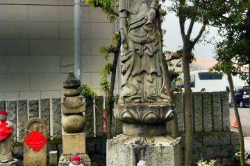 A droll-faced Kannon statue