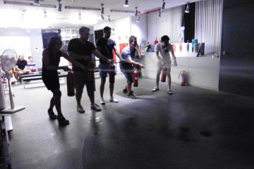 <p>Putting out a "fire". We may look like we are having fun but it was actually harder than I thought</p>