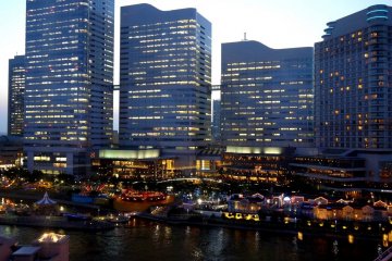 <p>Cosmo World amusement park nestles below tall skyscrapers</p>