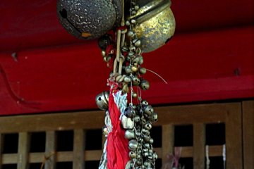 <p>Close-up of bells over the shrine</p>