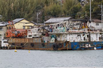 <p>A few industrial ships also line the harbor</p>