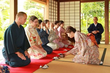 <p>Receiving tea and snacks in traditional form</p>