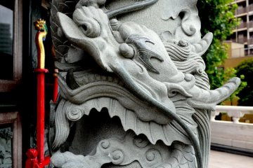 Stone dragon clutching a ball