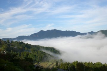 Watching the misty clouds hanging over the mountains from the deckchair on the terrace of your room