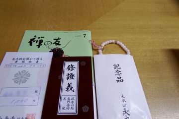 <p>If you make a 1,000 yen donation for roof tiles, they'll give you a token of gratitude like these, a Buddhist beads bracelet, a copy of sutra, a monthly Eiheiji magazine called 'Friend of Zen'</p>
