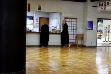 <p>Trainee monks at work</p>