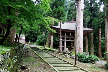 <p>The belfry stands silently in green woods permeated with the spirit of Zen</p>