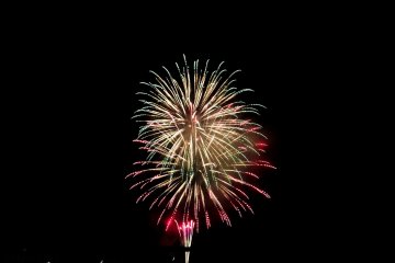 Nearing the finish! Several rainbow colored fireworks launch one of their last assaults of the evening