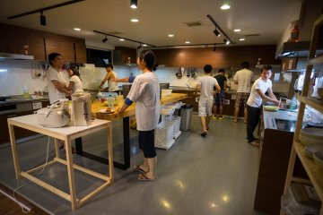 <p>The kitchen being use by a lot of people</p>