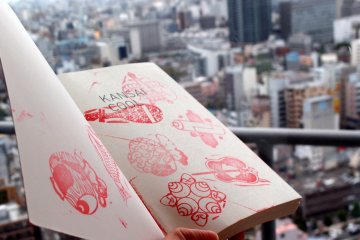 Kansai is cool indeed! Stamping the symbols of good fortune on the only available paper that I have.&nbsp;