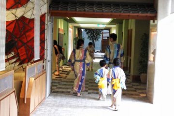 <p>A family going back to their room after taking a relaxing bath</p>