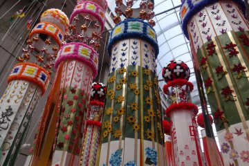 <p>The streamers hang from ten meter long bamboo poles in the city's covered shopping arcades</p>