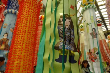 <p>Sendai's famous lord, one-eyed samurai Date Masamune, makes an appearance on a festival streamer</p>