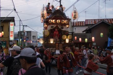 <p>Dashi being pulled down the street</p>