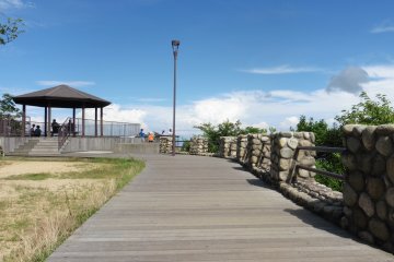 <p>A single dark cloud in the blue sky</p>