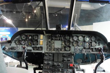 <p>Piloting (?) a helicopter!</p>
