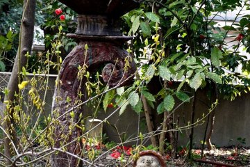 <p>I love this strange metal lantern with the small statues beneath</p>