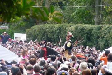 Samurai archer on horseback in a sea of spectators