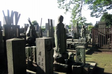 <p>Gotoku-ji has a cemetery filled with statues of various gods. Commonly you will see Japanese residents paying a visit to loved ones, making it a quiet and peaceful scenery.</p>