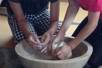 Mixing up the soba well in the bowls