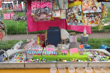Games and food stands are set up around the area for people to enjoy