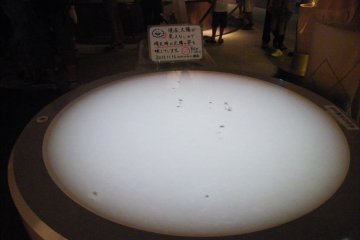 <p>Here, you can see sunspots. Unfortunately, it was a very cloudy day so seeing actual sunspots from the sun on that day wasn't possible. However, there were images of what the sunspots would usually look like.</p>