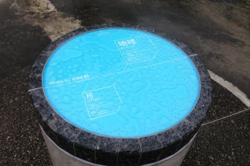 <p>One of the circular slabs representing the planets. This one is the Earth.</p>