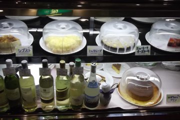 <p>Cakes and wine chilling at the front</p>