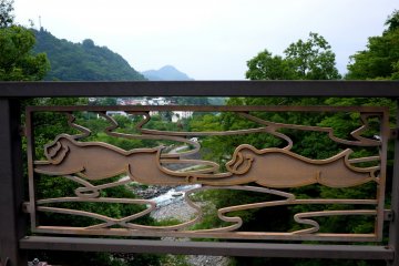 <p>The modern road bridge nearby has a monkey motif that references the legend of the bridge's inspiration</p>