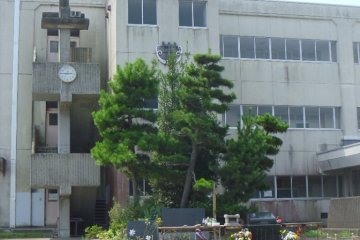 <p>The junior high school is still standing, empty, but saved for a little longer in case it's needed again for evacuation. Soon it will be torn down. Until then, the clock marks the time that the earthquake struck - 2:46pm</p>