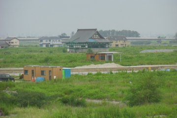 <p>Visible from the hill is the one temple out of three that survived. One was destroyed in the earthquake; the other in the tsunami.</p>