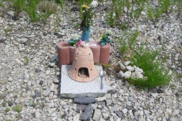 <p>Little offerings like this are some of the only reminders that houses once stood here</p>
