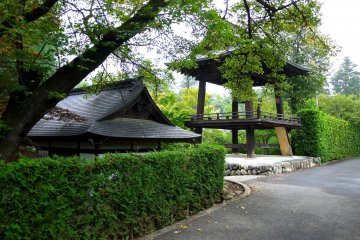 <p>The bell tower stands on one edge of the temple grounds</p>