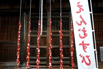<p>The writing says 'enmusubi', which means connected destiny (in a romantic sense)</p>