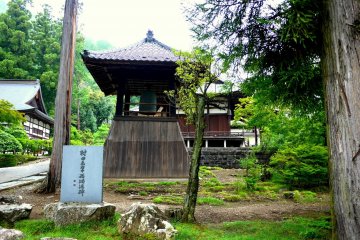 <p>The bell tower with two of the temple buildings in the background</p>