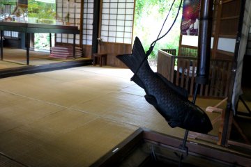 <p>There is a sunken hearth near the staircase</p>
