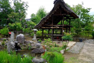 <p>The garden featured a small pond</p>