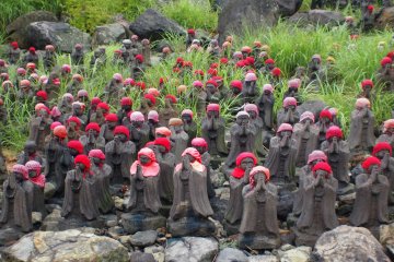 <p>On the way up to Sesshou Seki, the path is lined with small statues. These statues were placed here to represent lost babies</p>