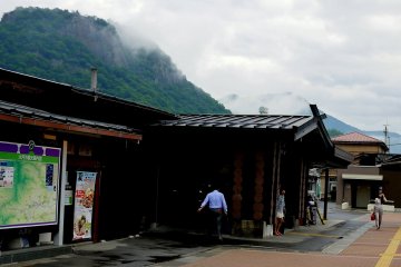 <p>Low cloud touches the rock face of Mount Iwadono</p>