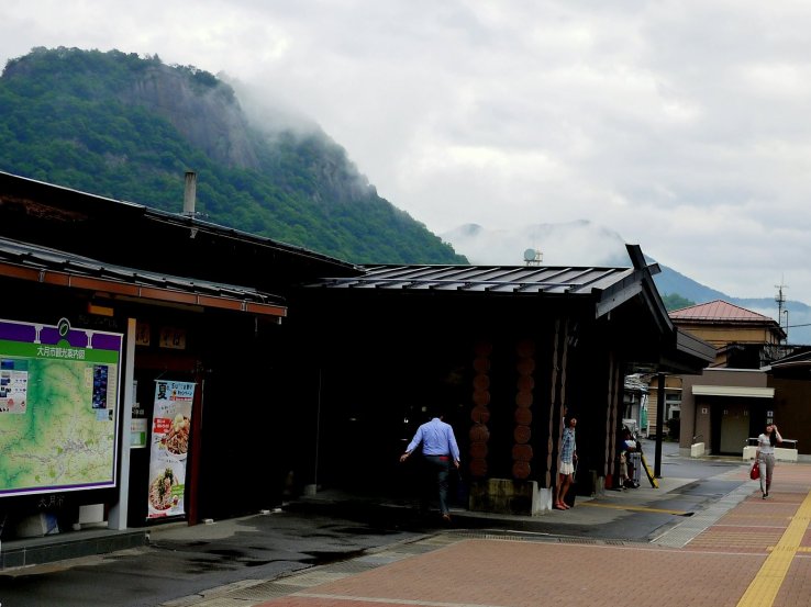 <p>Low cloud touches the rock face of Mount Iwadono</p>