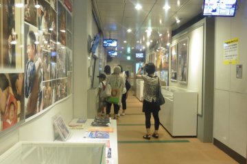 <p>The hallway from where it is possible to see the two filming studios</p>