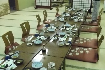 <p>The dining room set up for dinner</p>